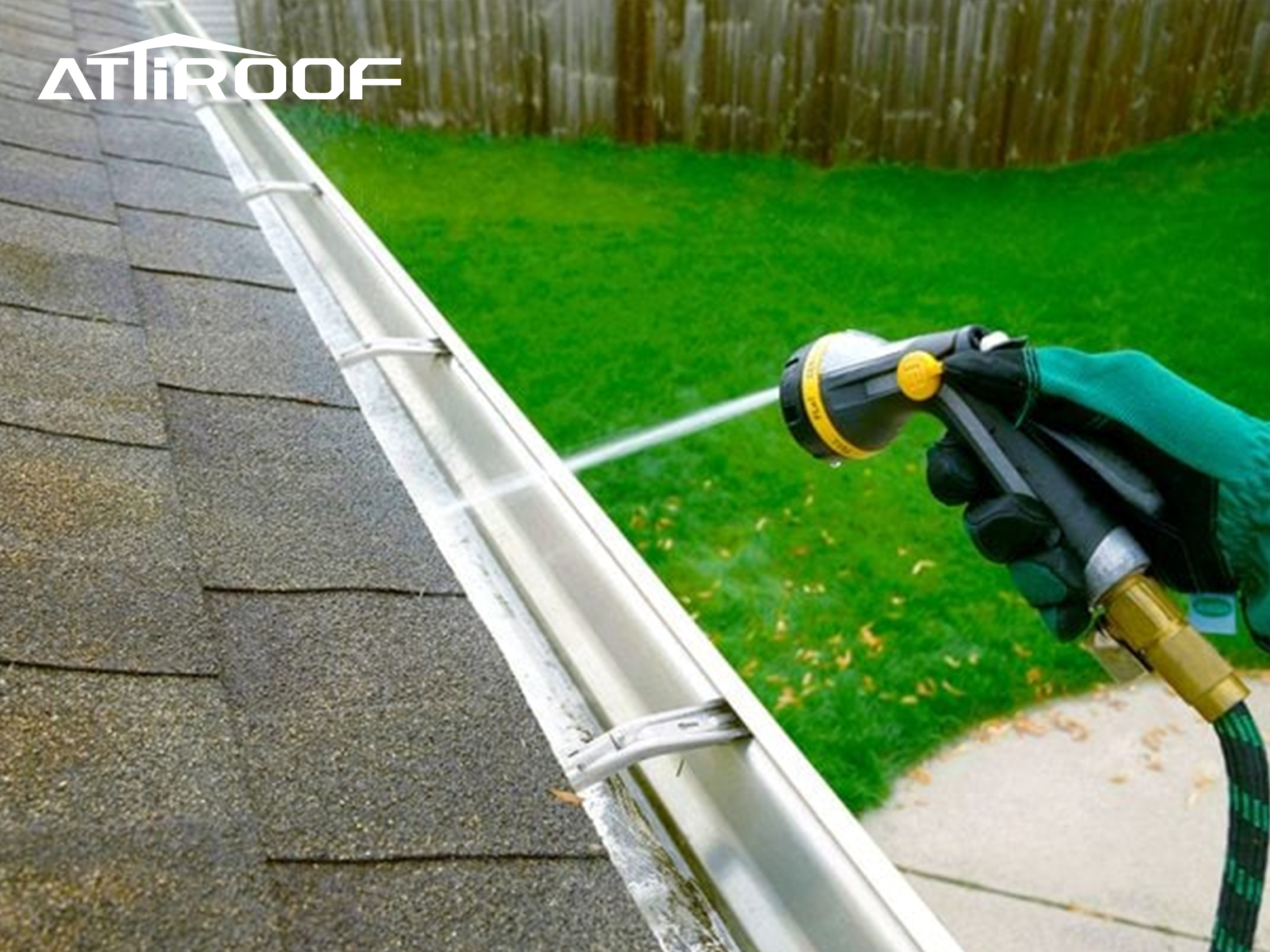 The workers are flushing the drainage system with garden pipes.